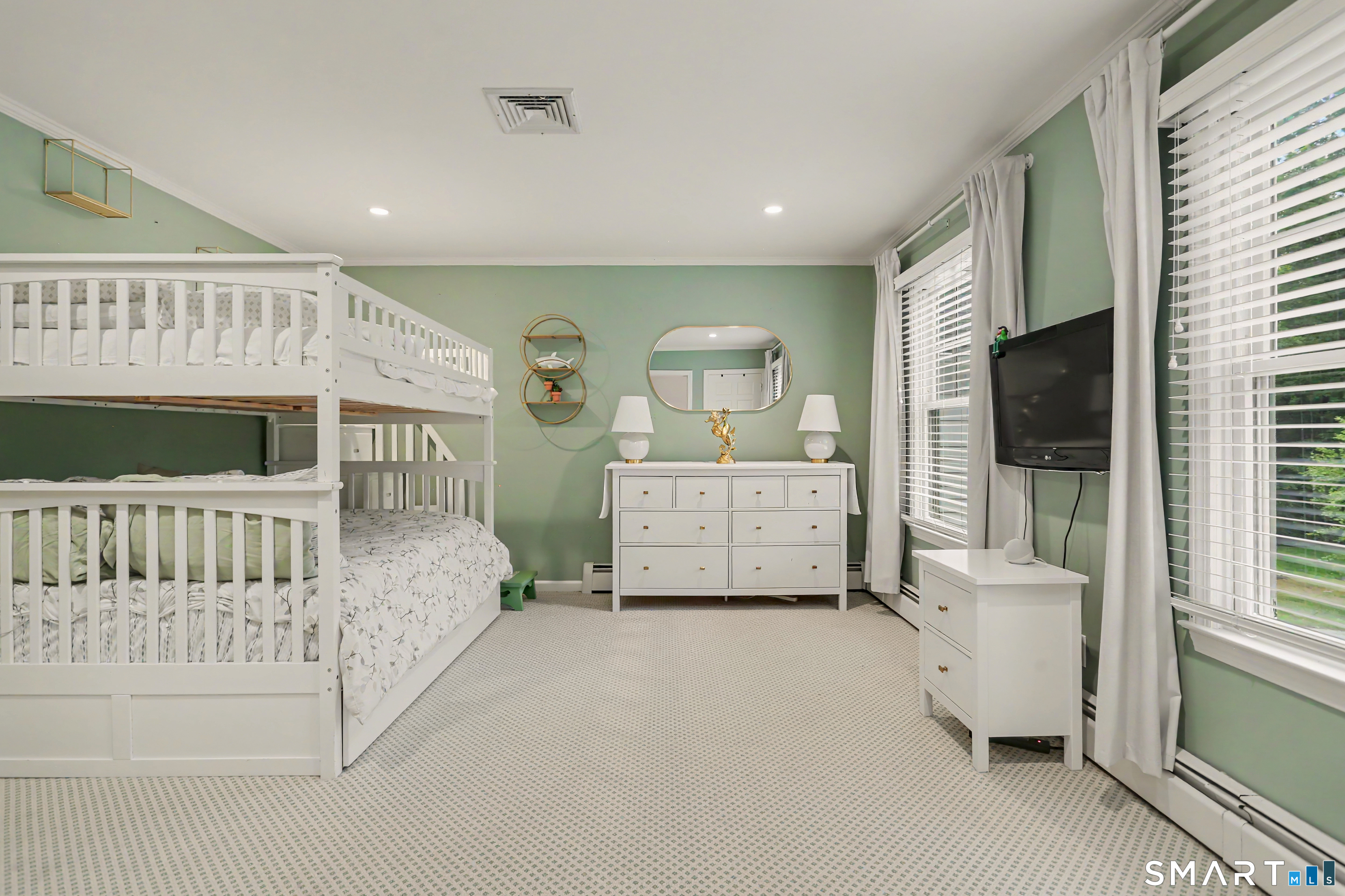 108 Logan Road New Canaan, CT 06840 - Photo 25 of 40 a spacious bedroom with a bed and a flat screen tv