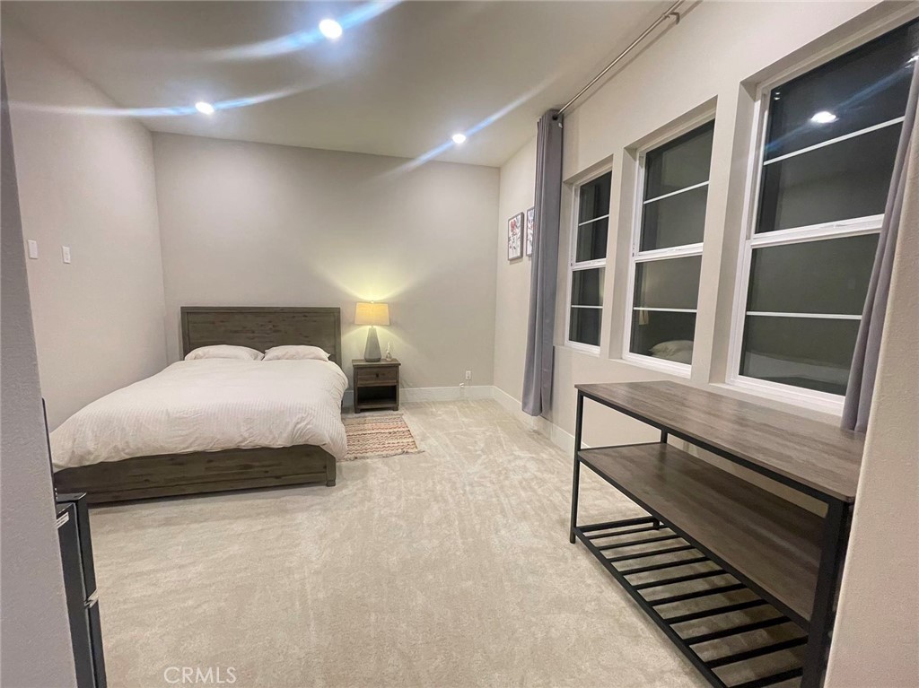 63 Cetus Irvine, CA 92618 - Photo 4 of 7 a bedroom with a bed and a window