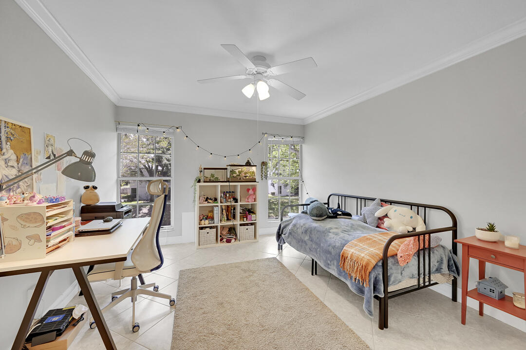 6245 Old Court Road, Unit 202 Boca Raton, FL 33433 - Photo 14 of 41 a bedroom with a bed and a chandelier