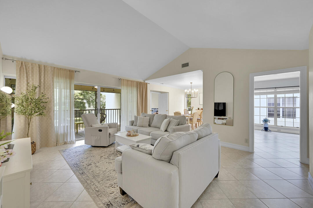 6245 Old Court Road, Unit 202 Boca Raton, FL 33433 - Photo 2 of 41 a living room with furniture and large windows