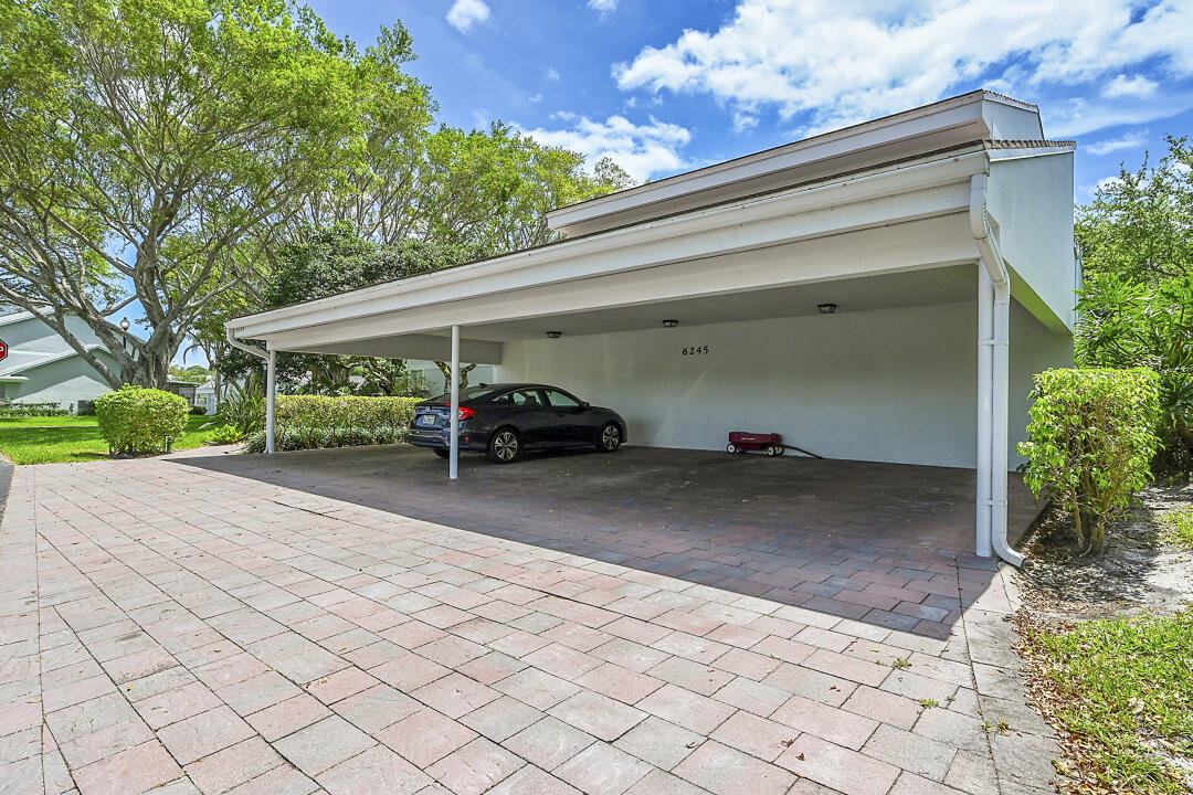 6245 Old Court Road, Unit 202 Boca Raton, FL 33433 - Photo 5 of 41 a couple of cars parked in front of a house