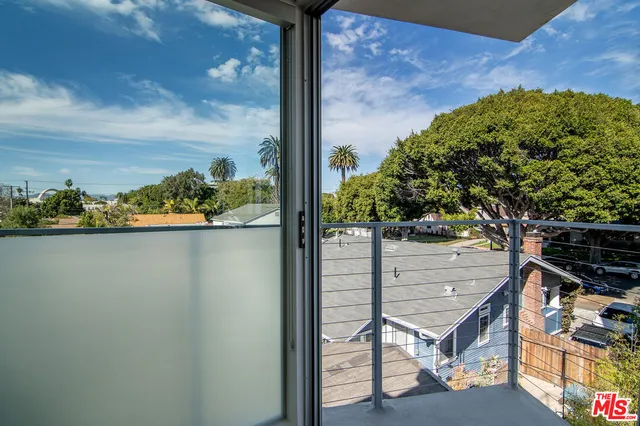 a view of balcony with wooden floor