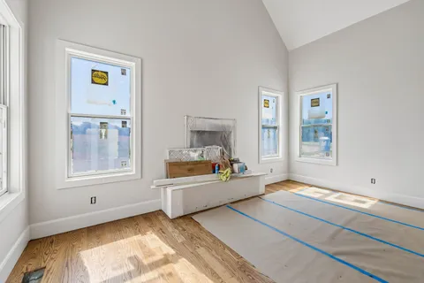 a view of a kitchen with furniture and window
