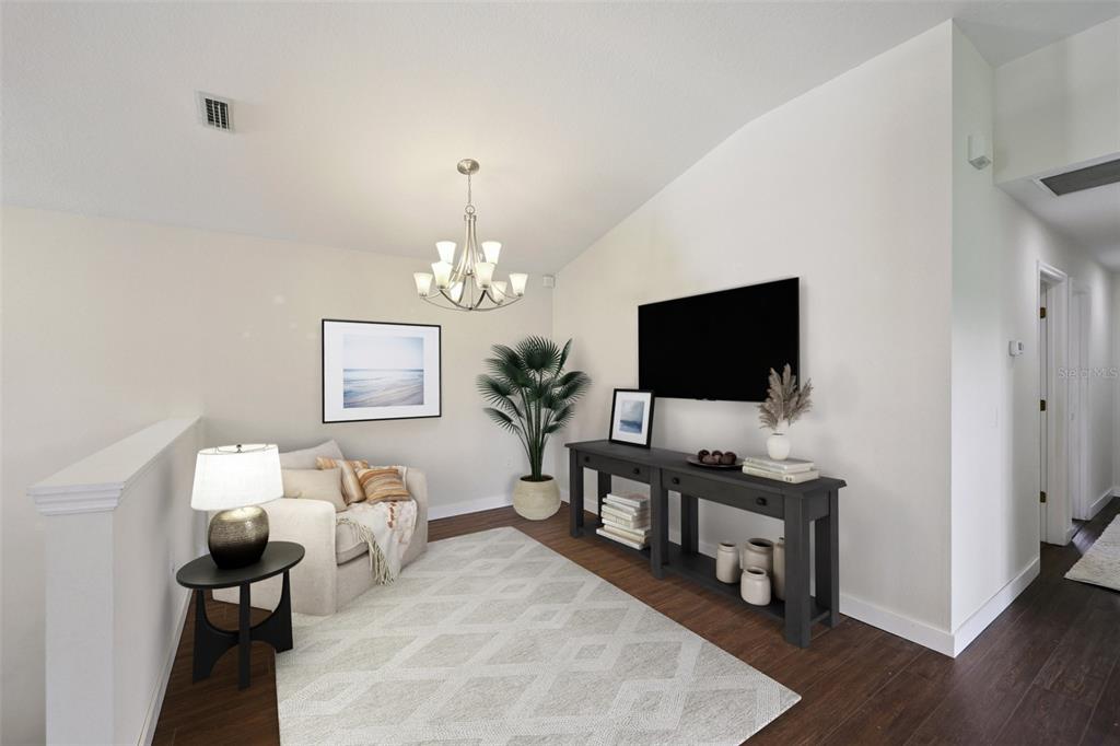 6412 Rosefinch Court, Unit 204 Lakewood Ranch, FL 34202 - Photo 11 of 33 a living room with furniture and a flat screen tv