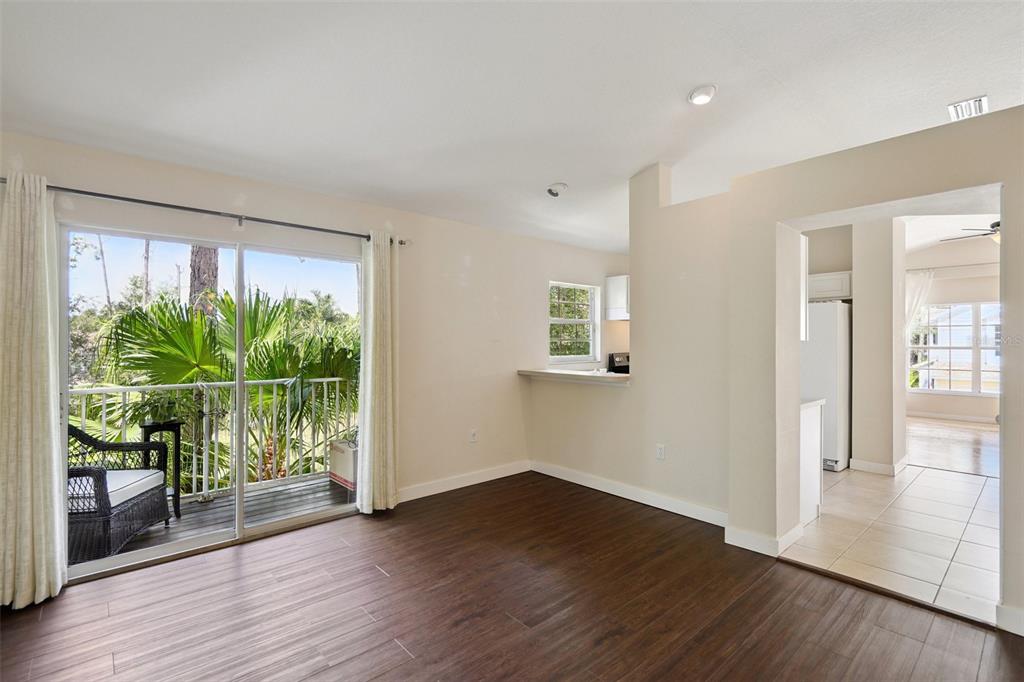 6412 Rosefinch Court, Unit 204 Lakewood Ranch, FL 34202 - Photo 13 of 33 wooden floor in an empty room with a window