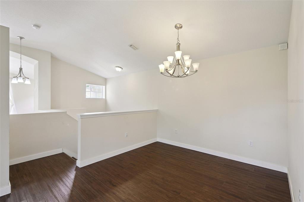 6412 Rosefinch Court, Unit 204 Lakewood Ranch, FL 34202 - Photo 14 of 33 a view of a room with wooden floor and a window