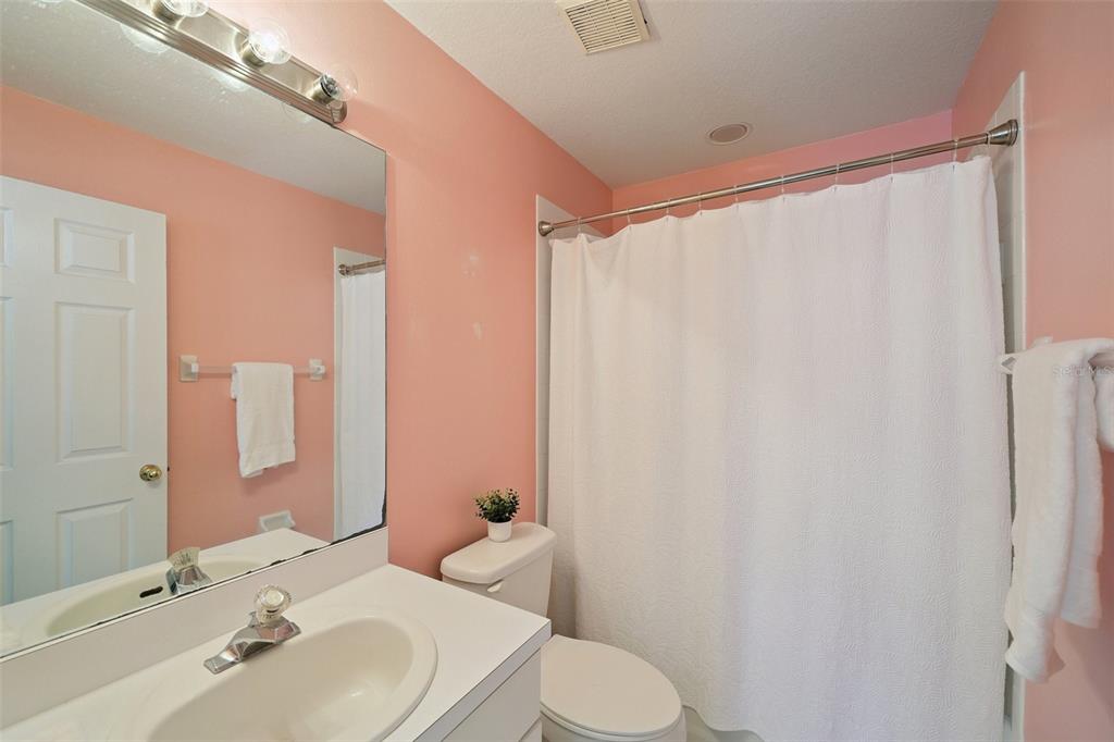 6412 Rosefinch Court, Unit 204 Lakewood Ranch, FL 34202 - Photo 18 of 33 a bathroom with a sink and a mirror