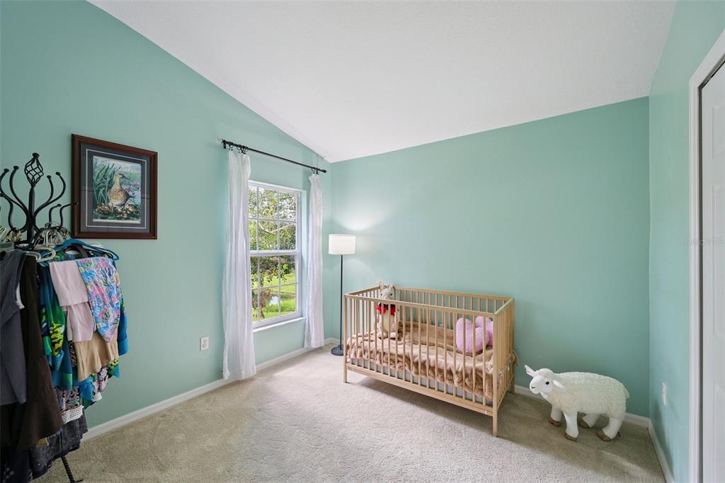 6412 Rosefinch Court, Unit 204 Lakewood Ranch, FL 34202 - Photo 19 of 33 a bedroom with furniture and a window