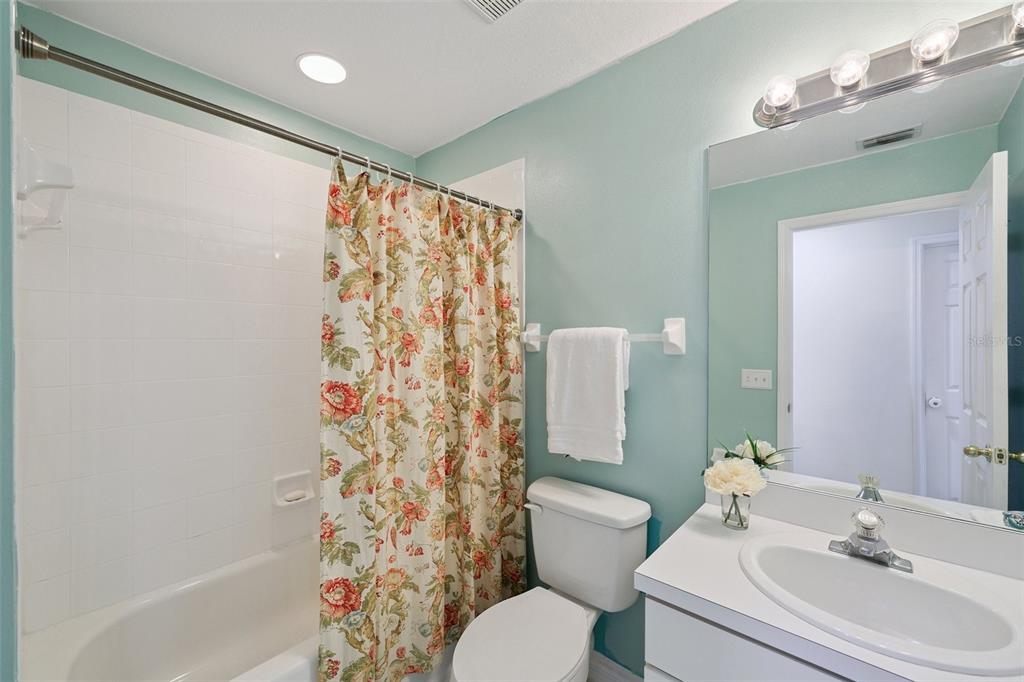 6412 Rosefinch Court, Unit 204 Lakewood Ranch, FL 34202 - Photo 20 of 33 a bathroom with a sink toilet and shower