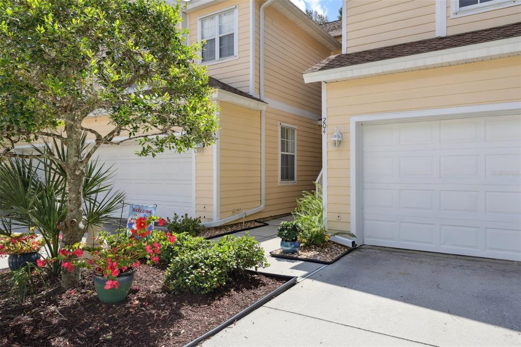 6412 Rosefinch Court, Unit 204 Lakewood Ranch, FL 34202 - Photo 2 of 33 a view of a house with potted plants