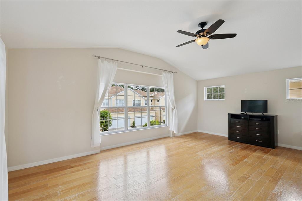 6412 Rosefinch Court, Unit 204 Lakewood Ranch, FL 34202 - Photo 25 of 33 a view of a livingroom with a ceiling fan and window