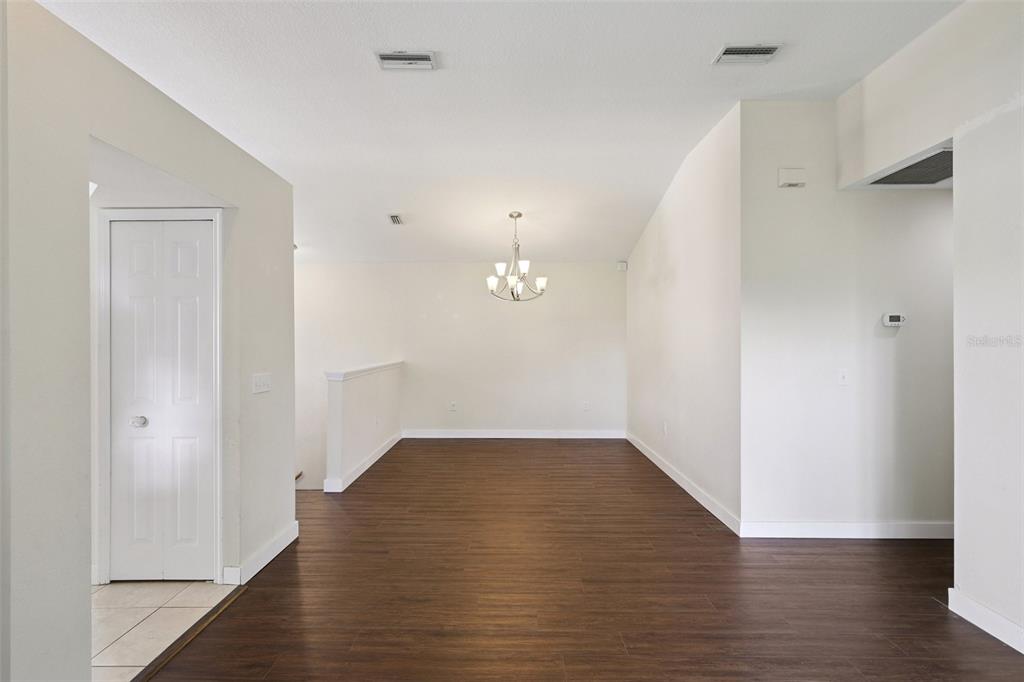 6412 Rosefinch Court, Unit 204 Lakewood Ranch, FL 34202 - Photo 27 of 33 wooden floor in an empty room with wooden floor