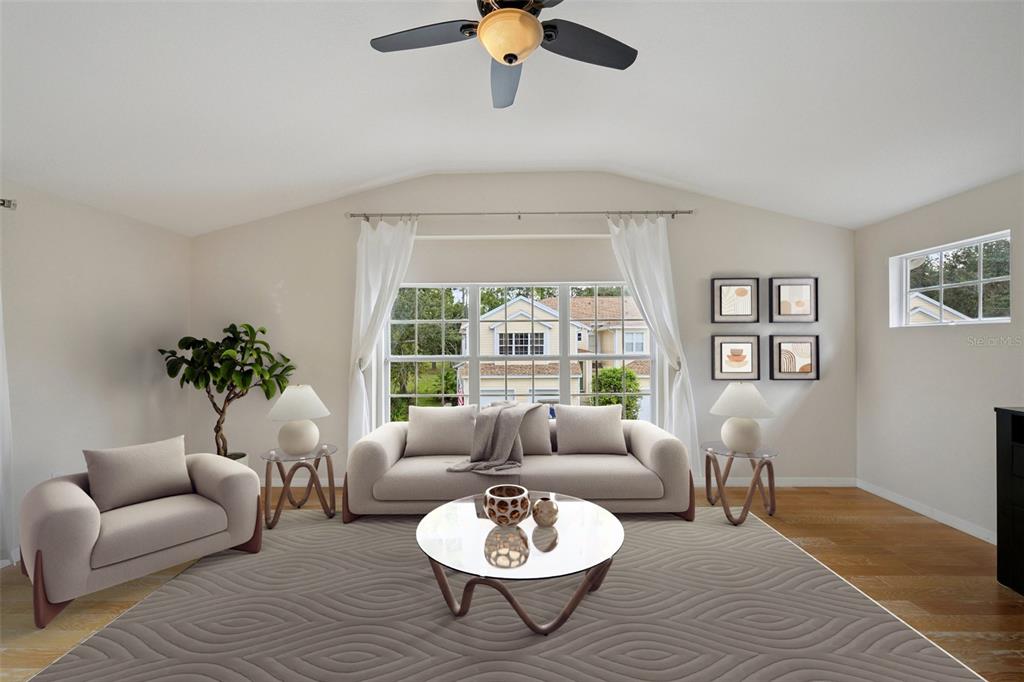 6412 Rosefinch Court, Unit 204 Lakewood Ranch, FL 34202 - Photo 4 of 33 a living room with furniture and a window