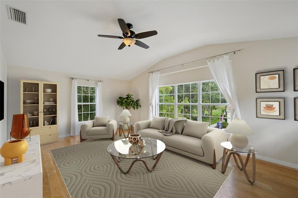 6412 Rosefinch Court, Unit 204 Lakewood Ranch, FL 34202 - Photo 6 of 33 a living room with furniture and a large window