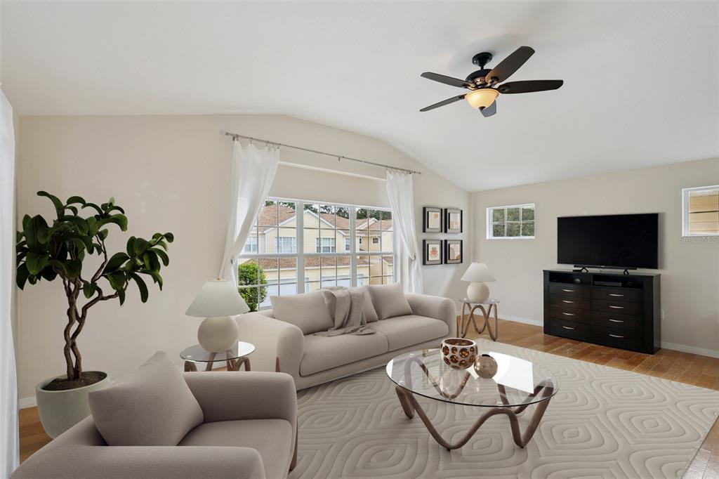 6412 Rosefinch Court, Unit 204 Lakewood Ranch, FL 34202 - Photo 7 of 33 a living room with furniture and a flat screen tv