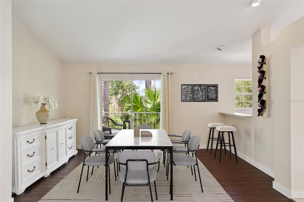 6412 Rosefinch Court, Unit 204 Lakewood Ranch, FL 34202 - Photo 9 of 33 a view of a dining room with furniture window and wooden floor