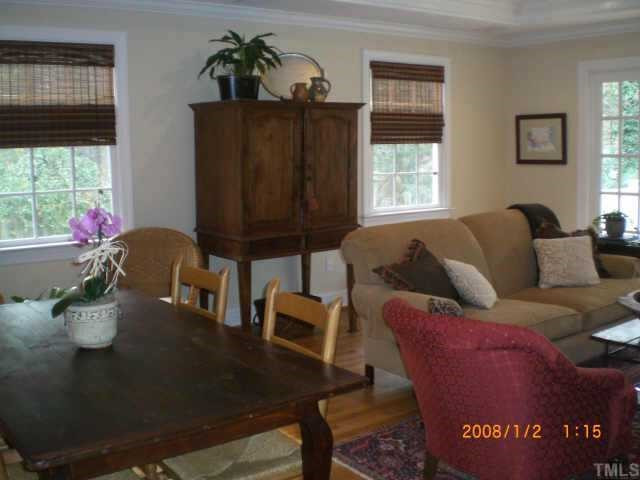Kitchen has large bar w/barstools and pantry (not shown). Informal table separates family room and kitchen Other