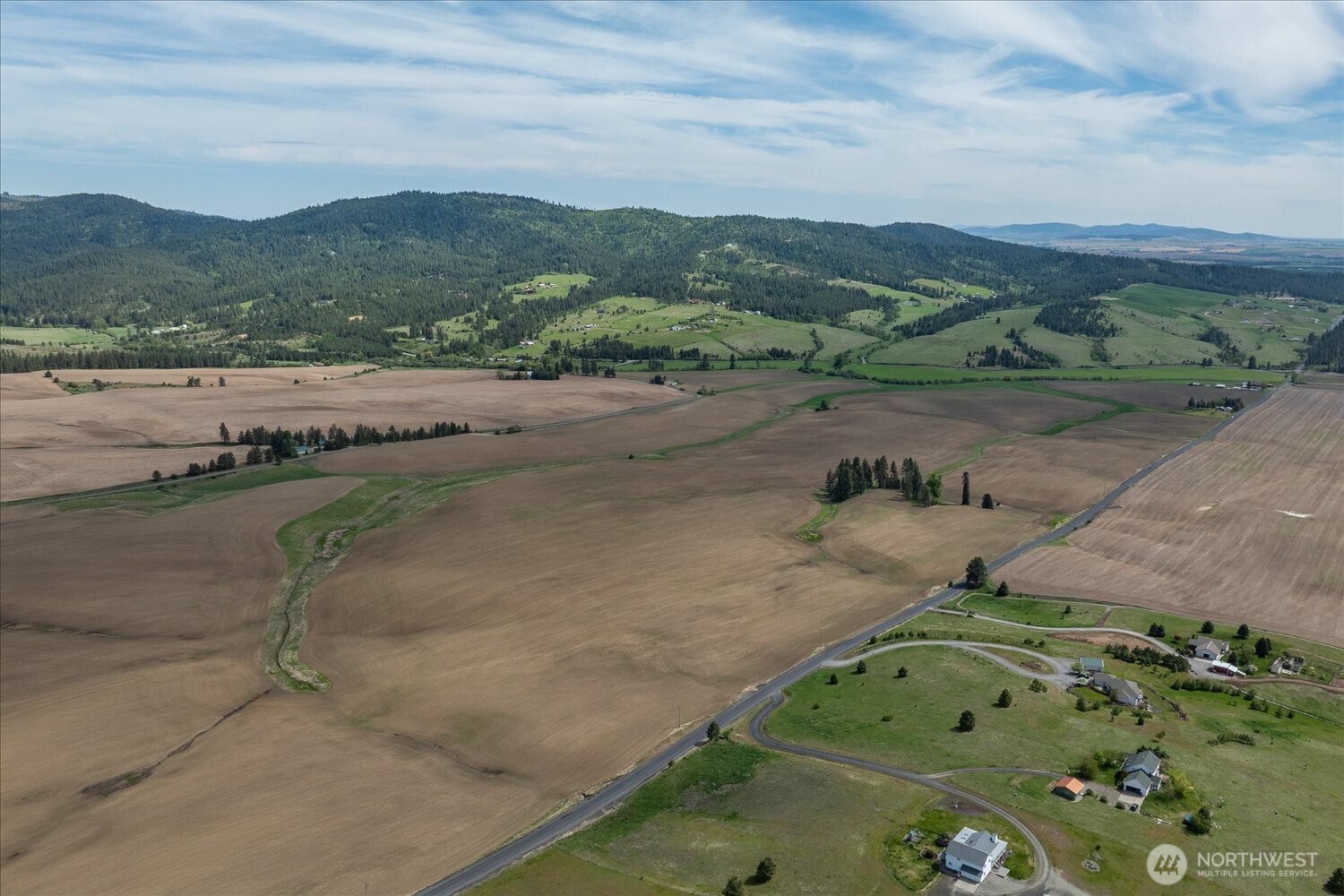 -xxx South Jackson Road, Unit LOT 17 Mica, WA 99023 - Photo 11 of 40 an aerial view of a houses with a yard