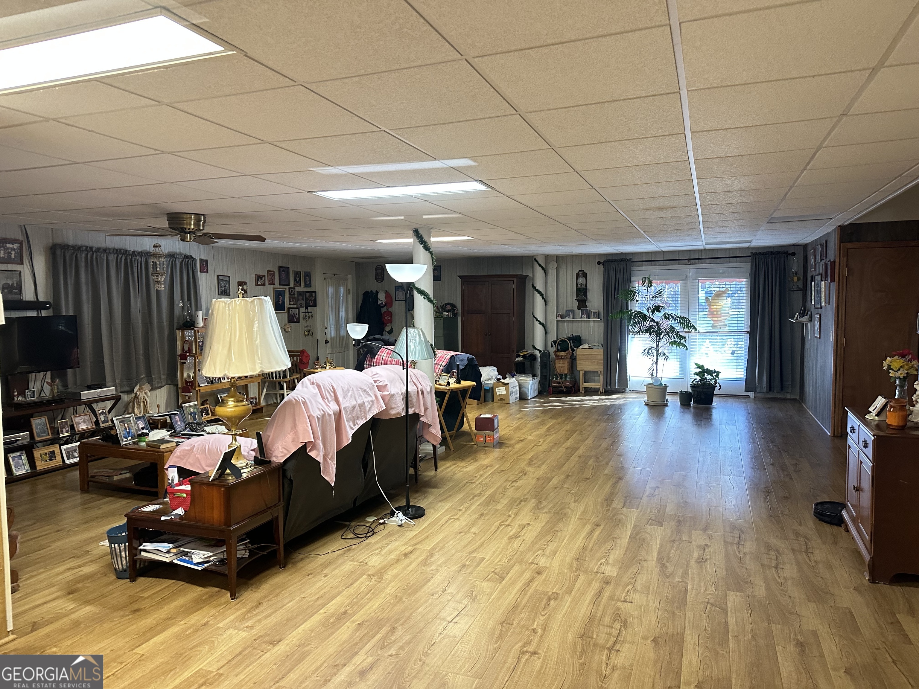 202 Taylor Road Talbotton, GA 31827 - Photo 11 of 32 a living room with furniture and a wooden floor