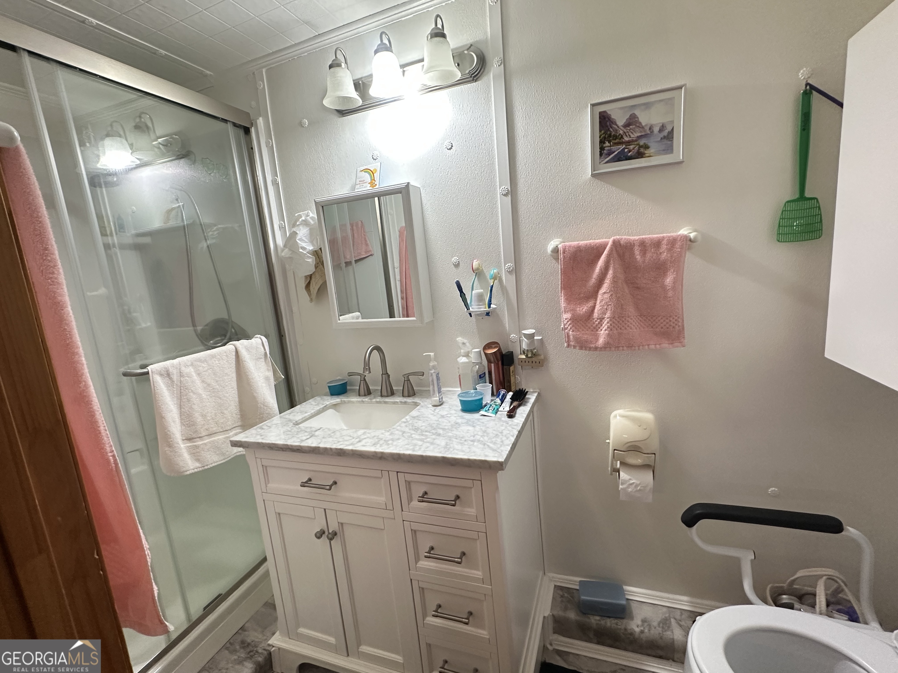 202 Taylor Road Talbotton, GA 31827 - Photo 10 of 32 a bathroom with a sink vanity granite and a mirror