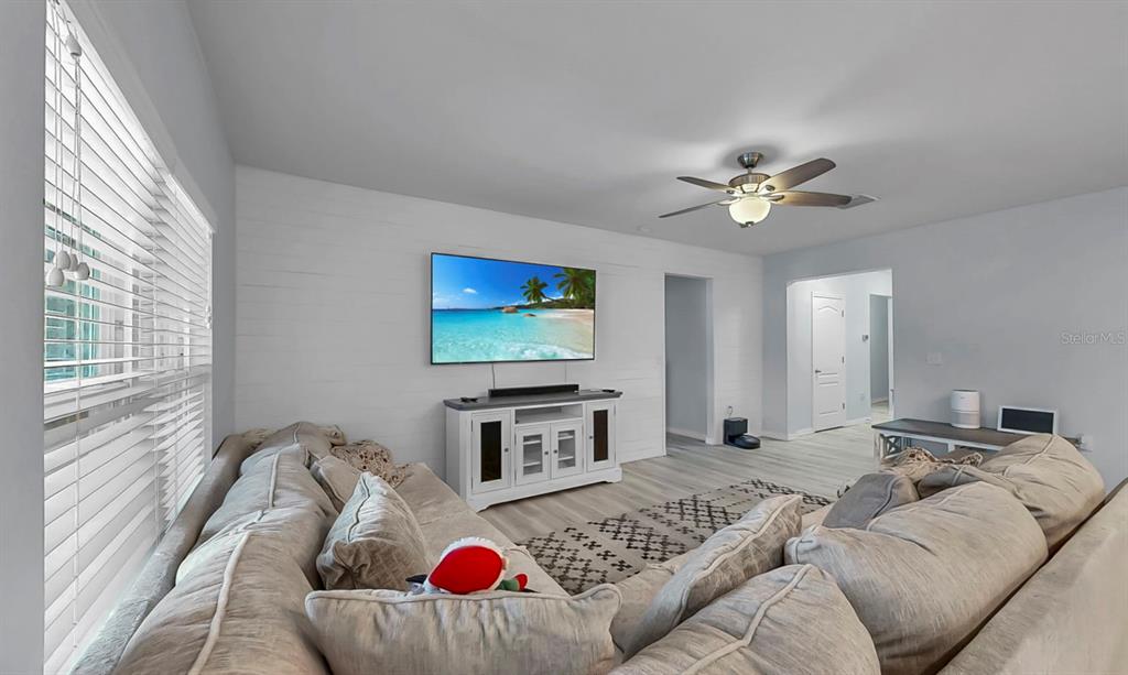 14530 Haddon Mist Drive Wimauma, FL 33598 - Photo 11 of 44 a living room with furniture and a flat screen tv