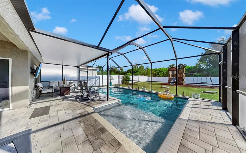 14530 Haddon Mist Drive Wimauma, FL 33598 - Photo 28 of 44 a view of a swimming pool with a patio