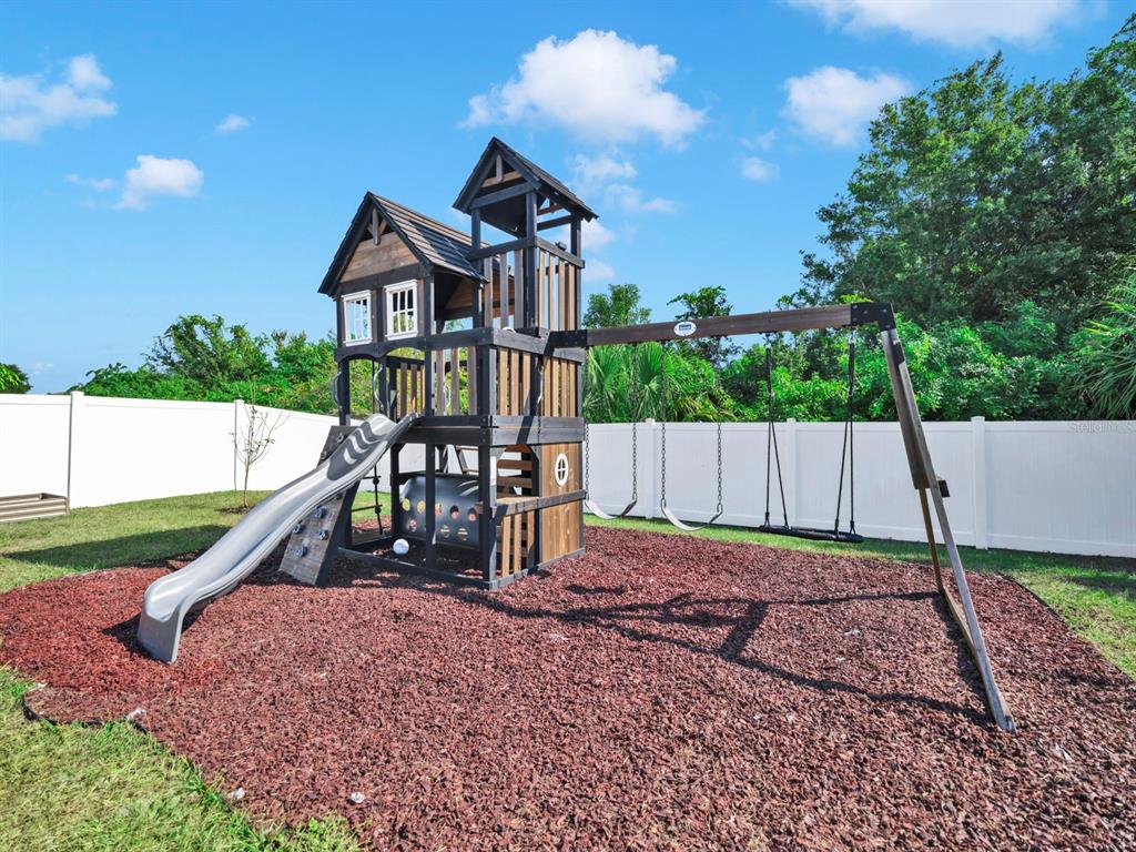 14530 Haddon Mist Drive Wimauma, FL 33598 - Photo 33 of 44 a house view with a garden space