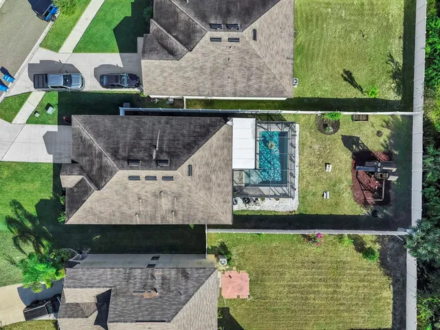 an aerial view of a house with a garden