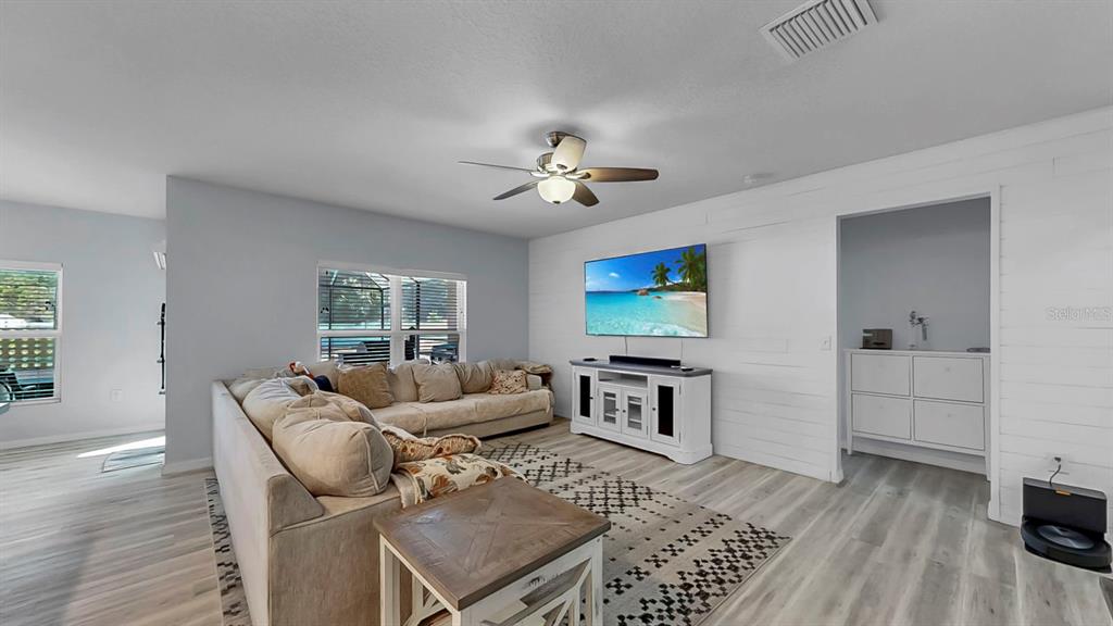 14530 Haddon Mist Drive Wimauma, FL 33598 - Photo 9 of 44 a living room with furniture and a flat screen tv