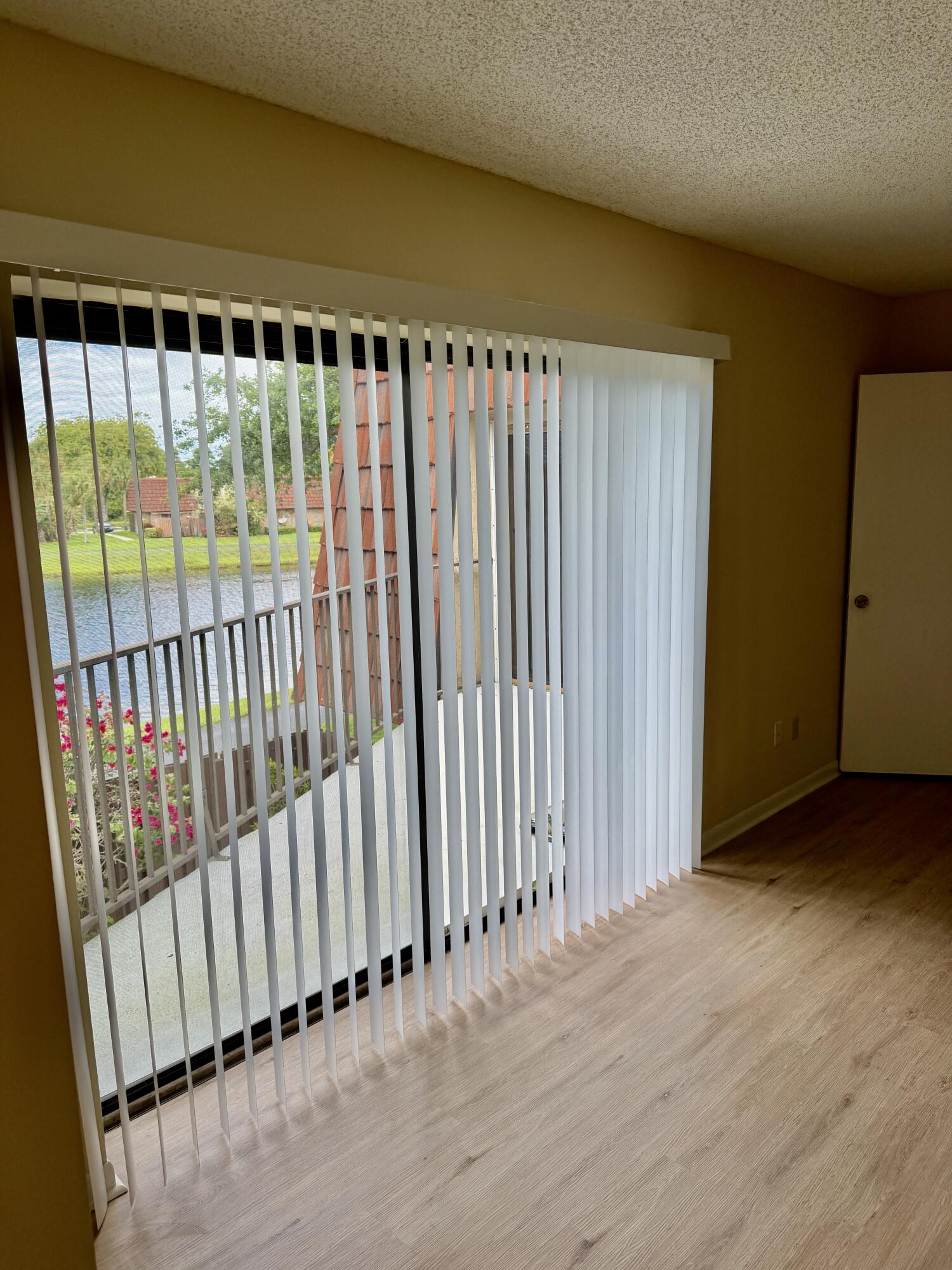 8461 Boca Rio Drive Boca Raton, FL 33433 - Photo 18 of 27 PRIMARY SLIDING DOORS TO BALCONY