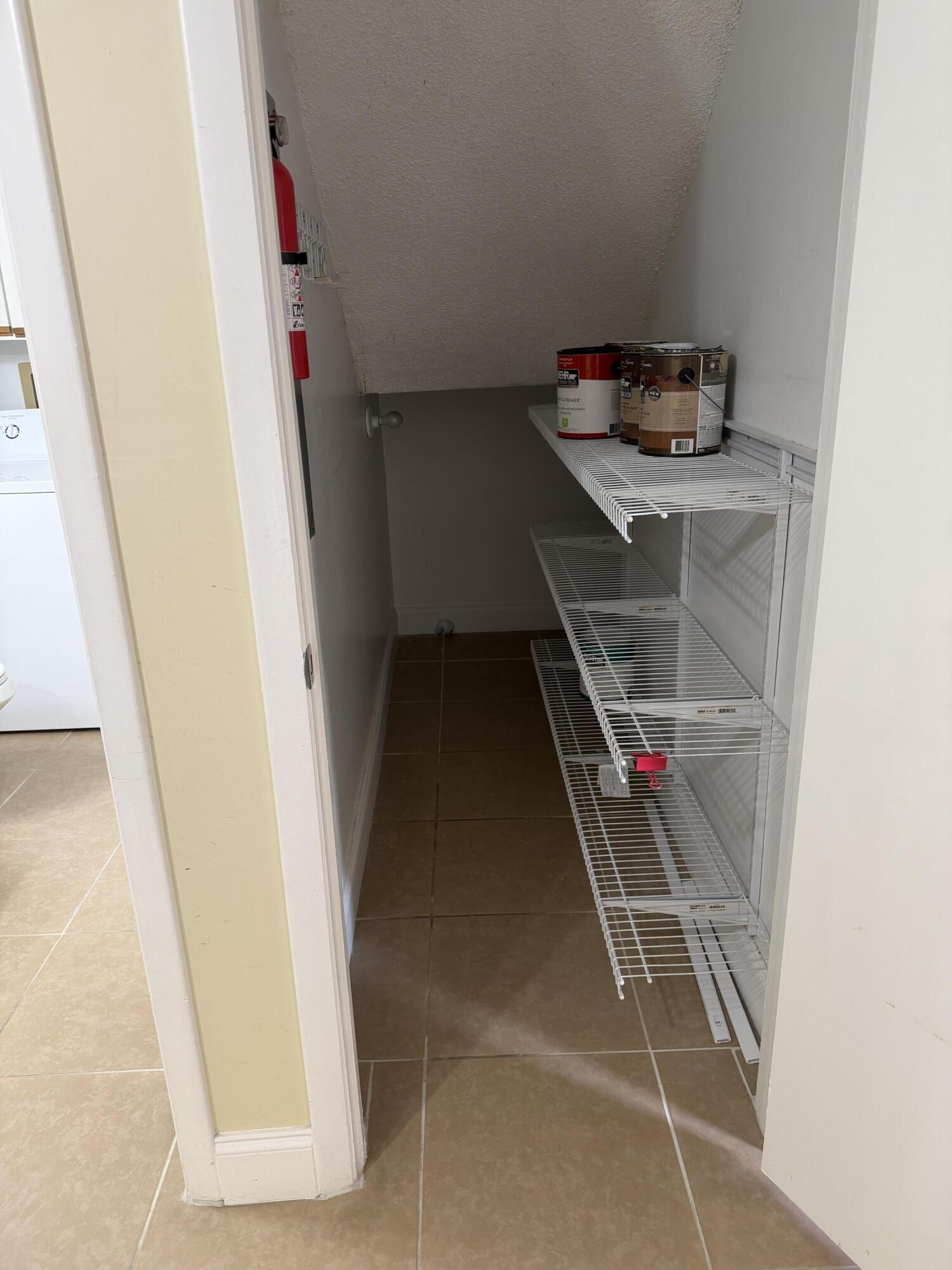 8461 Boca Rio Drive Boca Raton, FL 33433 - Photo 9 of 27 STORAGE UNDER STAIRCASE