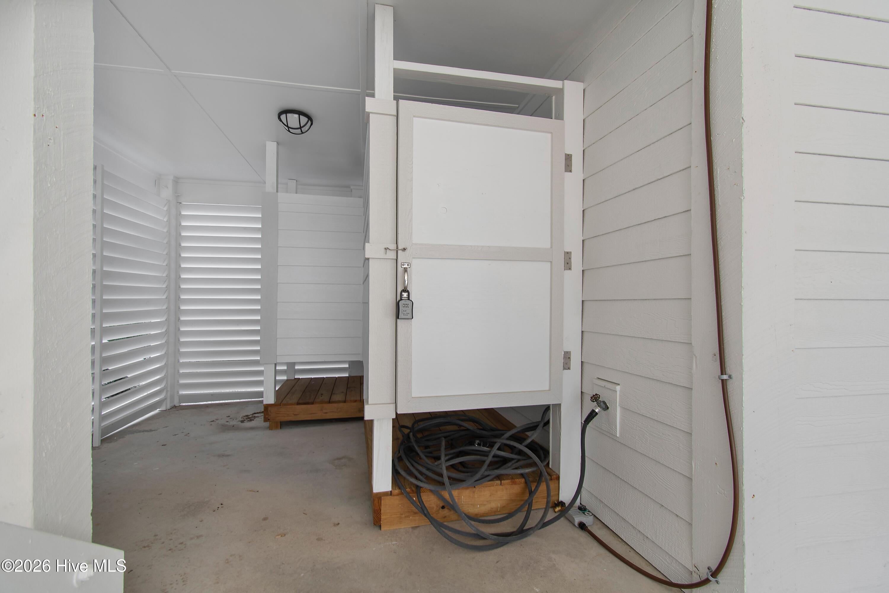 1707 East Main Street Sunset Beach, NC 28468 - Photo 30 of 44 Outside Shower with Privacy Louvers