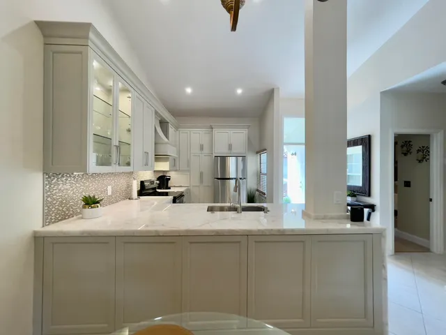 a bathroom with a sink a mirror and a bathtub