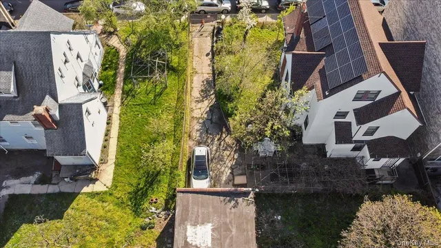 an aerial view of a house with swimming pool