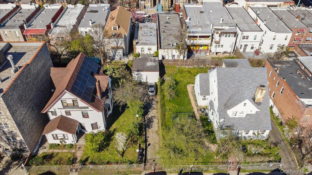 1428 Doris Street Bronx, NY 10462 - Photo 16 of 26 an aerial view of a residential apartment building with a yard