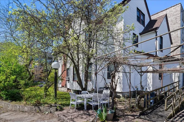a view of a large building with large trees