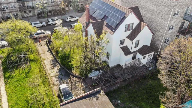 a aerial view of a house with a yard and garden
