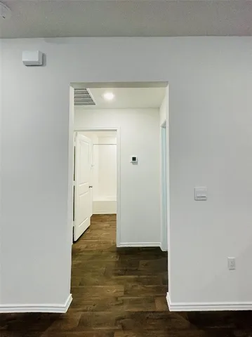 an empty room with a empty space and window