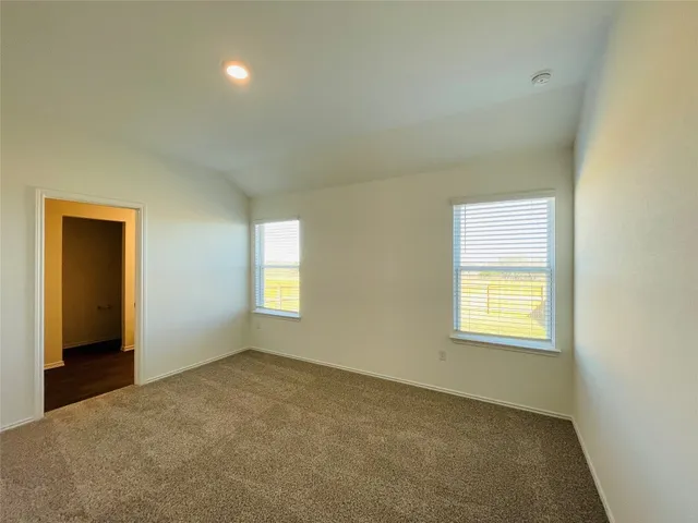 a view of bathroom with a sink mirror and shower