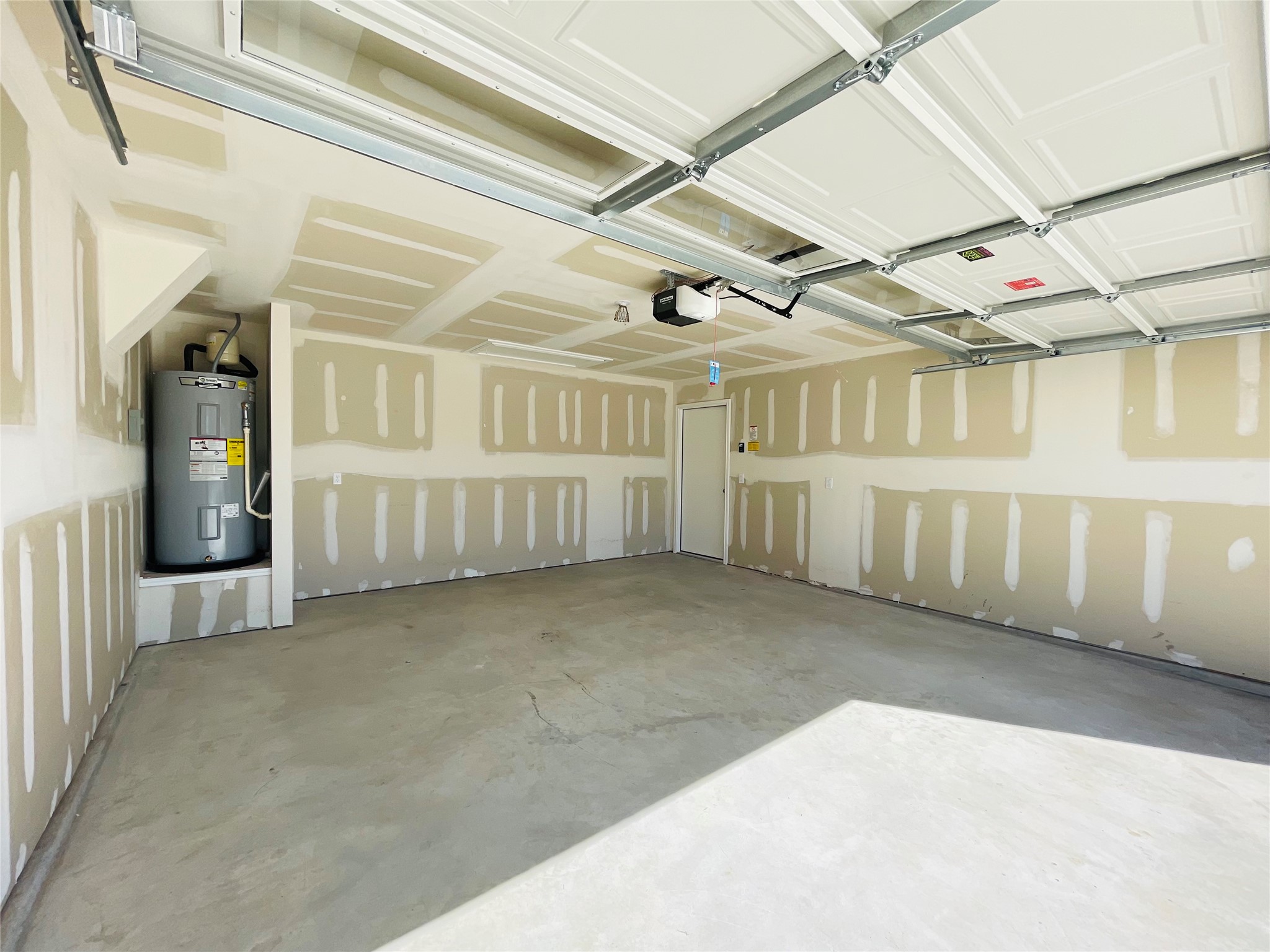 18508 A High Flyer Way Manor Manor, TX 78653 - Photo 20 of 32 Garage with water heater