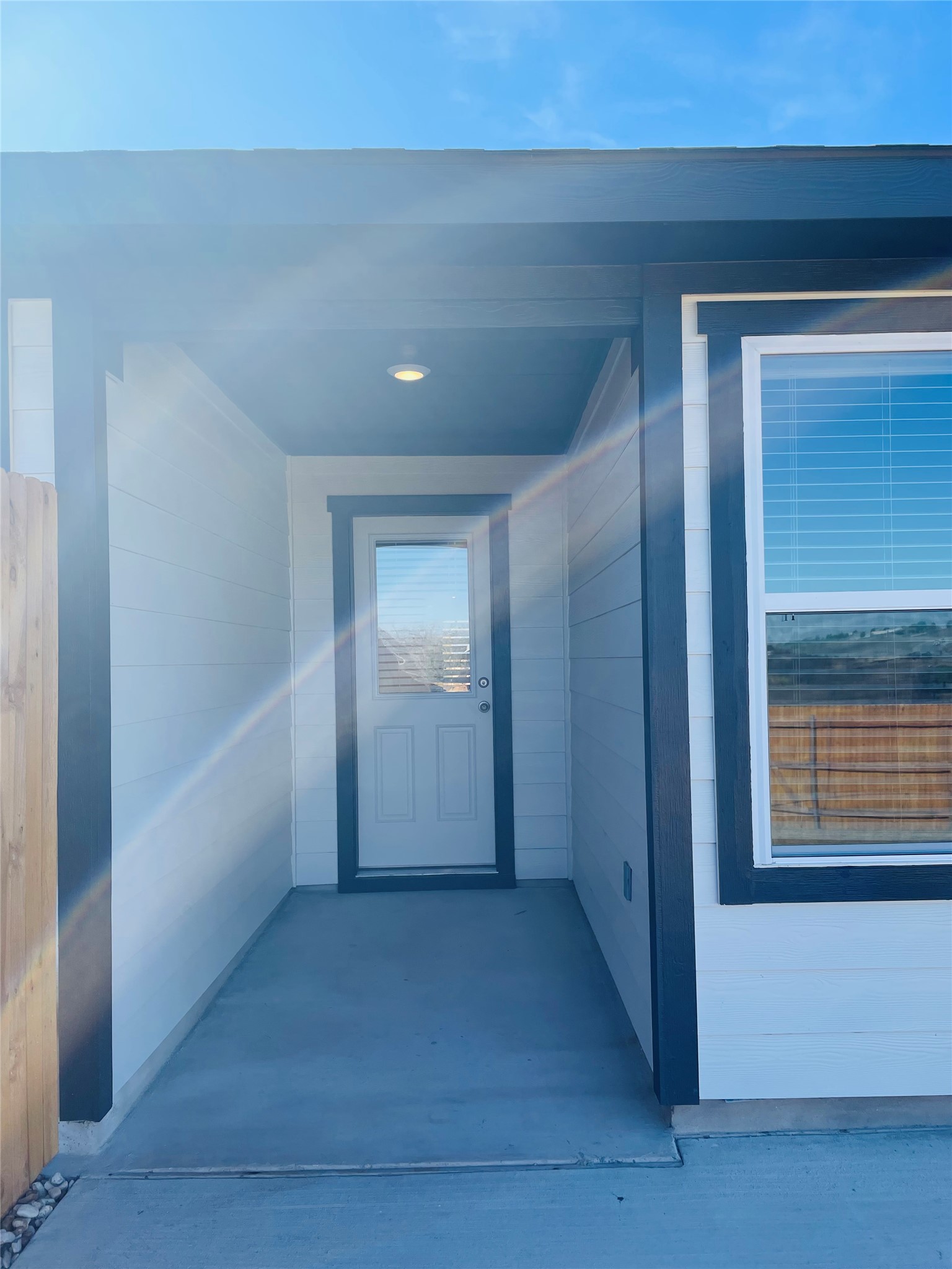 18508 A High Flyer Way Manor Manor, TX 78653 - Photo 21 of 32 Backyard with covered patio and extended concrete floor