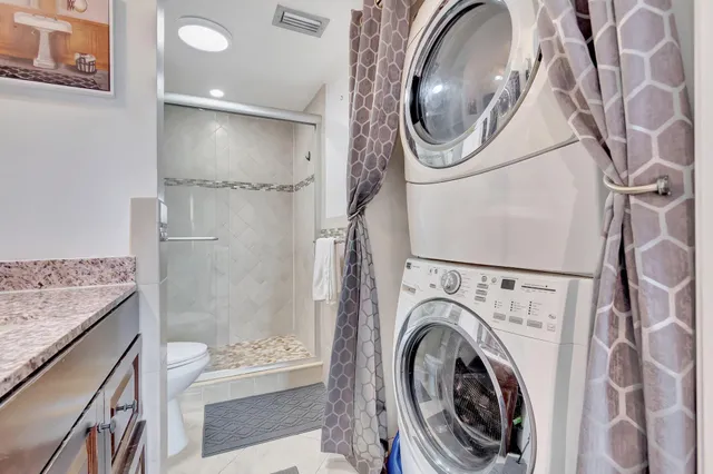 a bathroom with a washer and dryer