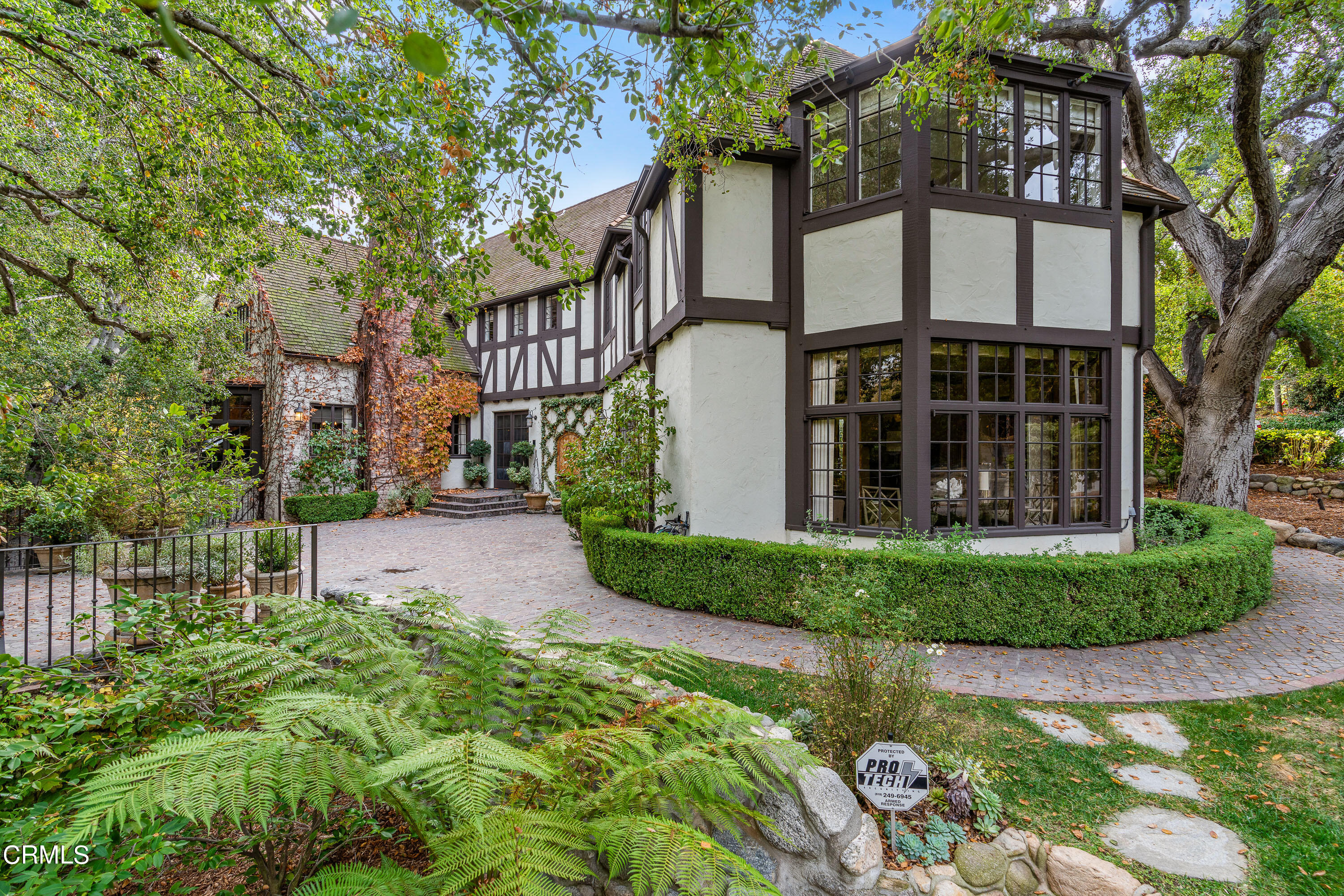 front view of a house with a garden