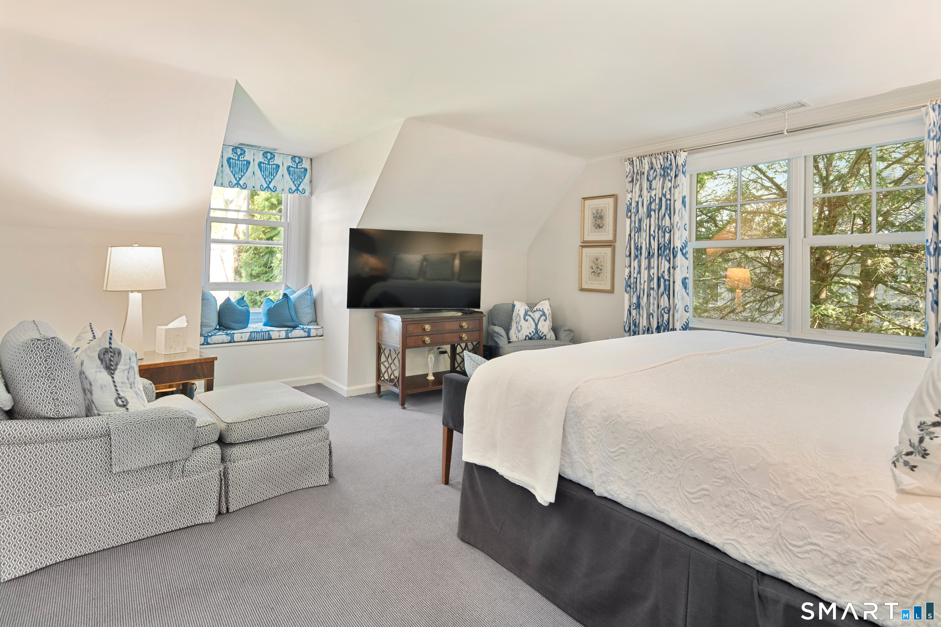 11 McLaren Road South Darien, CT 06820 - Photo 25 of 40 a spacious bedroom with a bed and a flat screen television