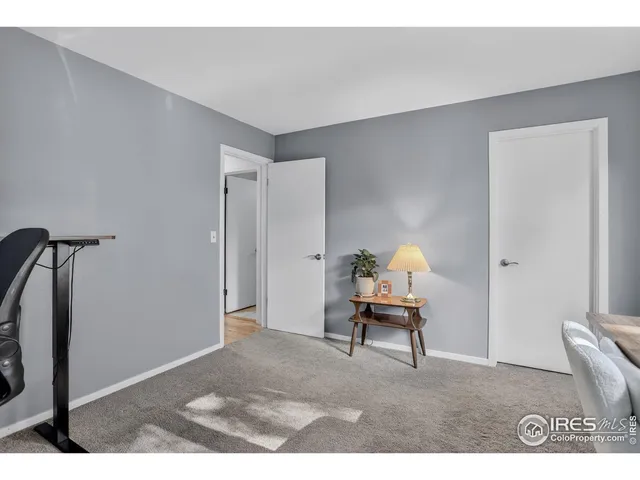 a bedroom with a bed and a chair