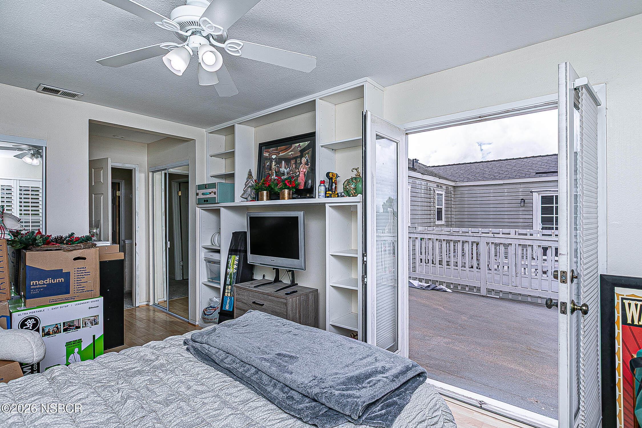 712 Pebble Beach Place Santa Maria, CA 93454 - Photo 15 of 31 a bedroom with a bed dresser and a flat tv screen
