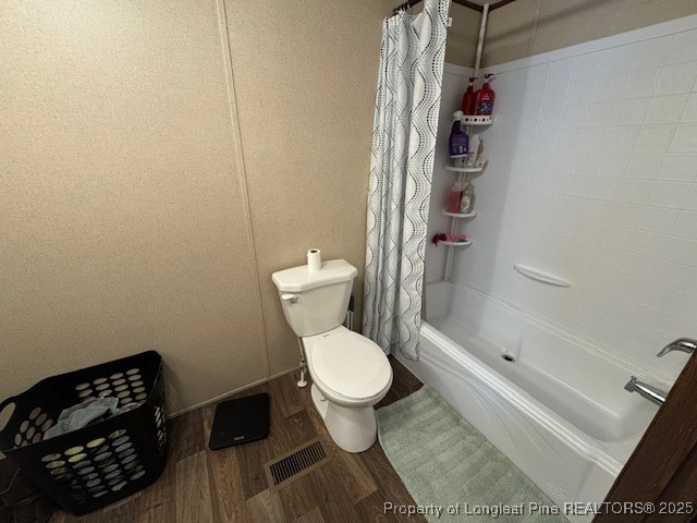 176 Fire Tower Road Orrum, NC 28369 - Photo 11 of 14 a bathroom with a toilet and a shower