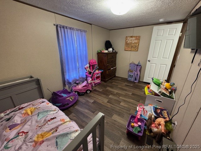 176 Fire Tower Road Orrum, NC 28369 - Photo 12 of 14 a bedroom with furniture and a wooden floor
