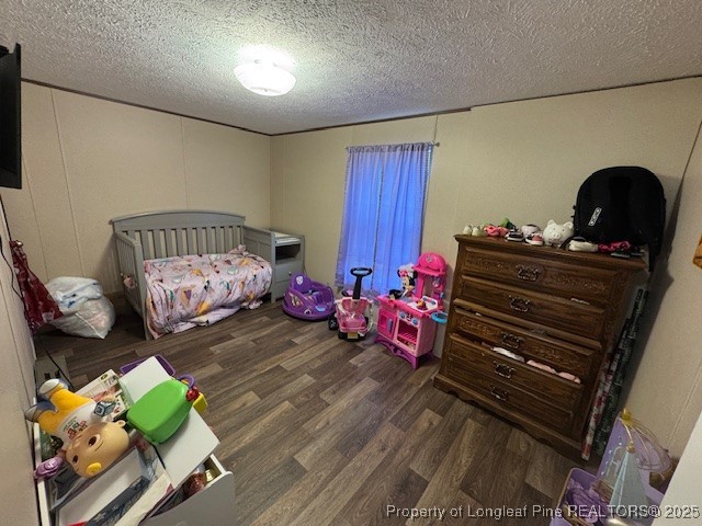 176 Fire Tower Road Orrum, NC 28369 - Photo 13 of 14 a bedroom with furniture and a wooden floor