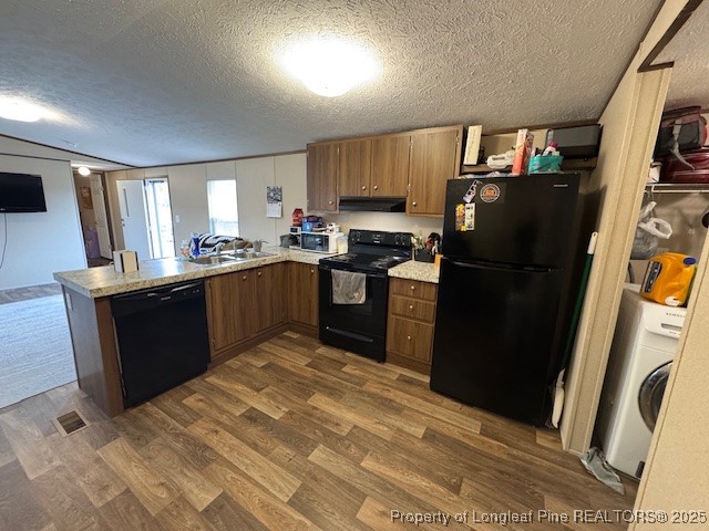 176 Fire Tower Road Orrum, NC 28369 - Photo 6 of 14 a kitchen with stainless steel appliances granite countertop a refrigerator a stove a sink dishwasher and a refrigerator